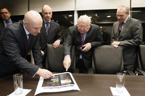 October 29, 2012 - 121029  -  Former Russian president Mikhail Gorbachev with his translator (L), goes over the Tuesday's front page with Paul Samyn and Bob Cox Monday October 29, 2012 at the Radisson Hotel. Gorbachev is a speaker at We Day in Winnipeg. John Woods / Winnipeg Free Press