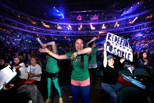 Students from all over Manitoba start screaming and standing in the aisle with their signs as We Day 2012 gets underway at the MTS Centre Tuesday morning. The annual We Day celebrations  in Winnipeg today with several iconic social activists and entertainers taking the stage at MTS Centre infront of 18,000 kids from around 400 schools from all over Manitoba. Marc Kielburger and his brother Craig  talk to the crowd at MTS Centre. Marc and Craig are internationally acclaimed childrens rights activists and co-founders of Free The Children. 121030 - Tuesday, October 30, 2012 - (RUTH BONNEVILLE / WINNIPEG FREE PRESS)   Ruth Bonneville