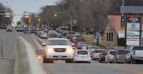 Brandon Sun Supper-time traffic moves along 18th Street near the Daly Overpass on Friday. (Bruce Bumstead/Brandon Sun)