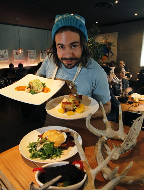Restaurant review.. Deer and (plus sign) Almond restaurant on Princess St. Owner/ Chef Mandel Hitzer  with dishes from front to back Filthy Dirty Pie, Benny and the Jets , Pork Belly and at left Steelhead Trout.  Marion Warhaft    review  (WAYNE GLOWACKI/WINNIPEG FREE PRESS) Winnipeg Free Press  Oct.31   2012