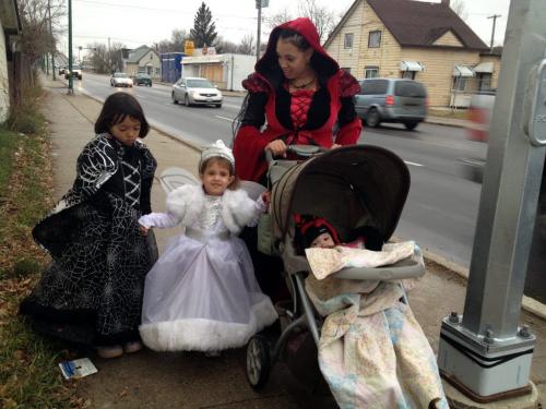 Frankie Edwards with Sunny,6, Starlynn, 3, and baby Selene, 16 months. Kids last name is Hudson. Not Edwards. The group started trick or treating early and were photographed walking down Arlington street at 4:20 pm. Boris Minkevich / Winnipeg Free Press. October 31, 2012