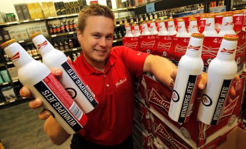 WINNIPEG, MB - Winnipeg Jets Budweiser Beer now avaiable in aluminum bottle. Labatts district sales manager Dan Chubey poses for a photo in the Grant Park mall MLCC. November 2, 2012  BORIS MINKEVICH / WINNIPEG FREE PRESS