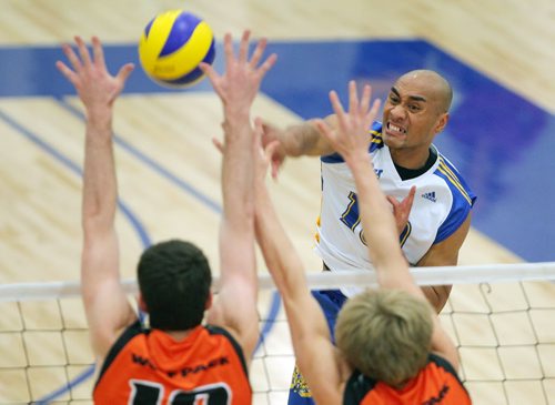 Brandon Sun 03112012 Sam Tuivai #10 of the brandon Bobcats men's volleyball team hammers the ball over the net during university volleyball action against the Thompson Rivers University Wolfpack at the Brandon University Healthy Living Centre on Saturday evening. (Tim Smith/Brandon Sun)