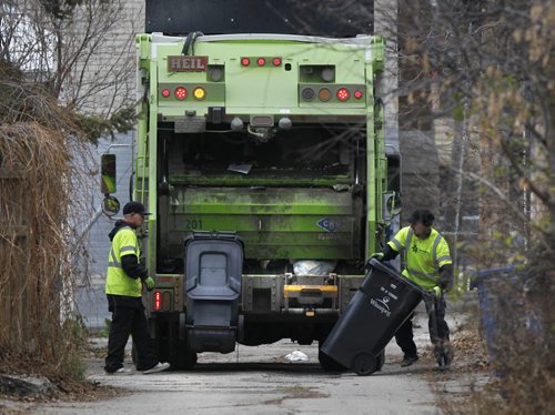 Emterra crew collects trash in Wolseley neighbourhood Monday. with story  (WAYNE GLOWACKI/WINNIPEG FREE PRESS) Winnipeg Free Press  Nov.5    2012