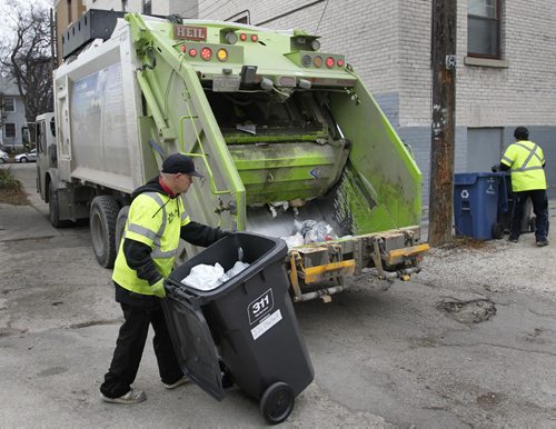 Emterra crew collects trash in Wolseley neighbourhood Monday. with story  (WAYNE GLOWACKI/WINNIPEG FREE PRESS) Winnipeg Free Press  Nov.5    2012