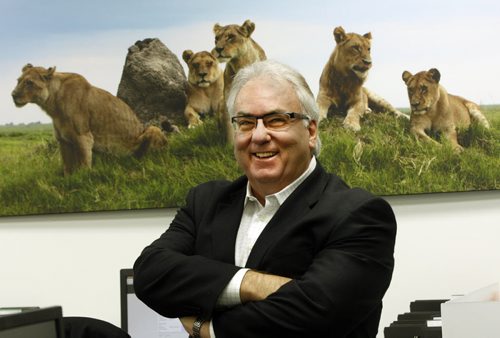 Jean-Pierre  Parenty  his translation company takes him all over the world , his office building is adorned with wildlife photographs he has taken - in pic African lions - , he runs a translation company  he started 20 years ago that makes manuals , brochures  instructional guides Äì the company employs over 100 linguists  - Carol Sanders story -  KEN GIGLIOTTI  / WINNIPEG FREE PRESS  /  Nov 6 2012