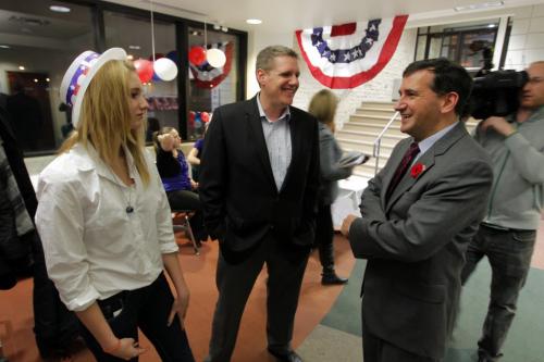 American consulate Tim Cipullo, right, holds an election party at the U of M. Here he talks to some people attending.l Left is Natalie Jebb and her dad, centre, Lee Jebb. They are from Brandon. November 6, 2012  BORIS MINKEVICH / WINNIPEG FREE PRESS