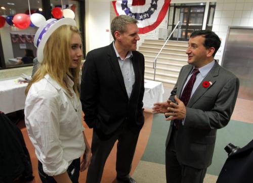 American consulate Tim Cipullo, right, holds an election party at the U of M. Here he talks to some people attending.l Left is Natalie Jebb and her dad, centre, Lee Jebb. They are from Brandon. November 6, 2012  BORIS MINKEVICH / WINNIPEG FREE PRESS