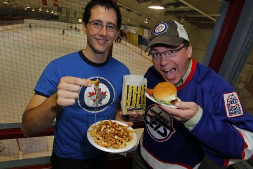 Chris Carman and Chris Zuk at Notre Dame Community Club with some Canteen food. Poutine, Popcorn, and real chicken burger. November 7, 2012  BORIS MINKEVICH / WINNIPEG FREE PRESS