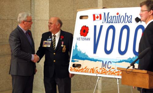 New speciality motorcycle licence plate for veterans.  Premier Greg Selinger, Rick Bennett, president, Manitoba/NW Ontario Command Members of local legions, and Rotunda, Legislative Building, and Andrew Swan, Minister of Justice and Attorney General unviel the new plate super sized. November 9, 2012  BORIS MINKEVICH / WINNIPEG FREE PRESS