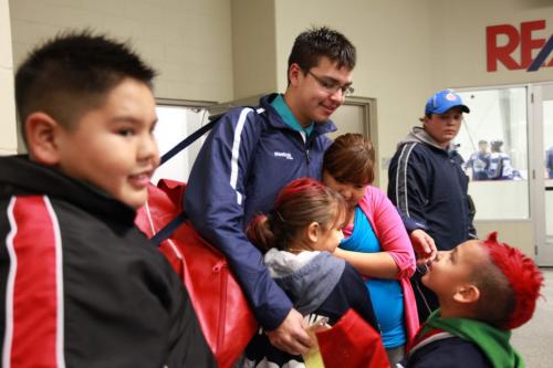Young Aboriginal Hockey star  Ralph Cochrane whol wears the #17 jersey for the OCN Blizzards is  showered with hugs and kisses from his family and frriends after his team won against the Portage Terriers at the Old Dutch MJHL Showcase Tournament  at IcePlex Arena Saturday. The OCN Blizzard won the game  2 -1 in a shootout. See Randy Turner's Native, Aboriginal hockey story.  Oct 06,  2012 (Ruth Bonneville/Winnipeg Free Press)