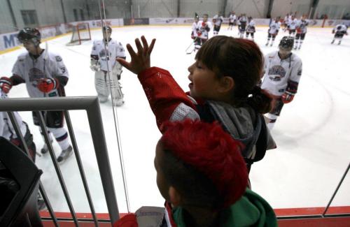 Young fans of the OCN Blizzards wave at the players as they leave the ice after their win against the Portage Terriers during the Old Dutch MJHL Showcase Tournament  at IcePlex Arena Saturday. The OCN Blizzard won the game  2 -1 in a shootout. ( #17 Ralph Cochrane who plays for the OCN Blizzards) SSee  Randy Turner's  Native, Aboriginal hockey story Oct 06,  2012 (Ruth Bonneville/Winnipeg Free Press)