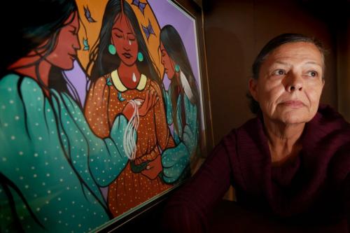 Portrait of Leslie Spillet is the executive director of Ka Ni Kanichihk, a community-based services centre. They developed a support program for families of missing and murdered women in Manitoba. Spillet sits next to a painting by Jackie Traverse depicting a event honoring missing and murdered women called "Wiping Away the Tears" See Randy Turner Story Nov 14 ,  2012 (Ruth Bonneville/Winnipeg Free Press)