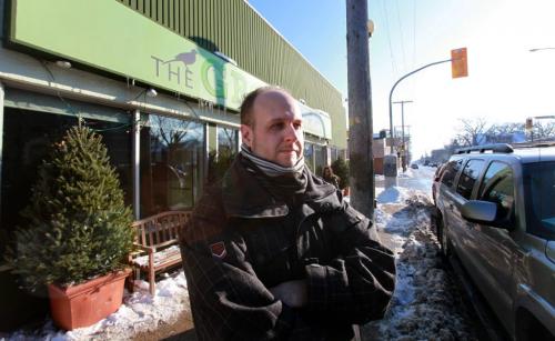 The Grove Corner of Stafford and Grosvenor Owner Miles Gould  outside to the plowed streets (his restaurant was almost vacant last night because customers feared getting towed by the 7 p.m. to 7 a.m. snow ban)t Nov 14 ,  2012 (Ruth Bonneville/Winnipeg Free Press)