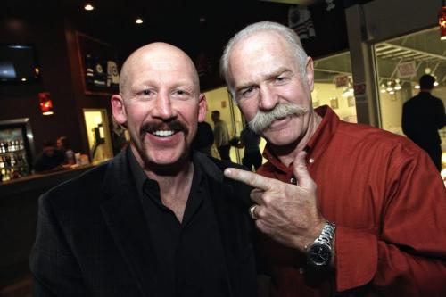 Lanny McDonald and his legendary stash with Mike Keane who is sporting a bit of lip hair for movember during the draft banquet for the Mike Keane Classic at the MTS IcePlex Wednesday evening.  121114 November 14, 2012 Mike Deal / Winnipeg Free Press