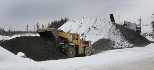 Front end loader dumps a bucket of zinc copper ore from the Chisel Mine North in Snow Lake, Manitoba.  Martin Cash story (WAYNE GLOWACKI/WINNIPEG FREE PRESS) Winnipeg Free Press  Nov. 14    2012