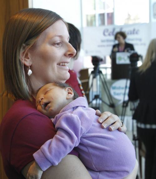 Leslie Hall holds her daughter Alivia, the 100th child born at the Birth Centre at a celebration to mark the first year anniversary and the 112 mothers that have given birth at the centre.    Larry Kusch story (WAYNE GLOWACKI/WINNIPEG FREE PRESS) Winnipeg Free Press  Nov. 15    2012