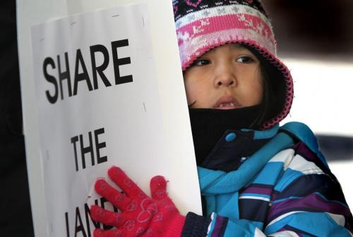 Five year old Setaiyah Leask from Lac Brochet reserve near Churchill Manitoba was one fo the youngest protestors outside 375 York,(Winnipeg Convention Centre)  as Manitoba First Nations rally at the front doors of the Manitoba Mines Convention 375 York Avenue Thursday afternoon.  Nov 15 ,  2012 (Ruth Bonneville/Winnipeg Free Press)