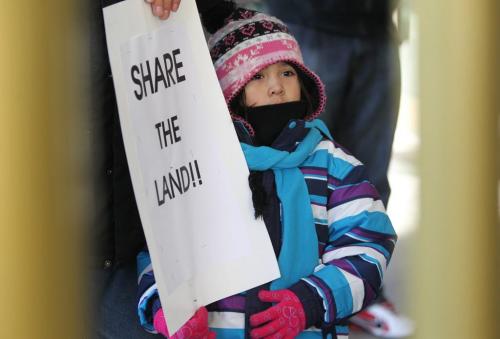 Five year old Setaiyah Leask from Lac Brochet reserve near Churchill Manitoba was one fo the youngest protestors outside 375 York,(Winnipeg Convention Centre)  as Manitoba First Nations rally at the front doors of the Manitoba Mines Convention 375 York Avenue Thursday afternoon.  Nov 15 ,  2012 (Ruth Bonneville/Winnipeg Free Press)