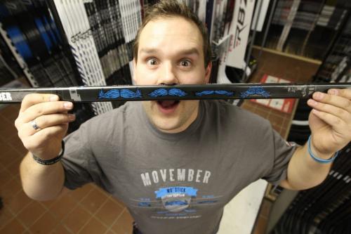 Kyle Johanson - Store Manager  of Source for Sports on Pembina shows special Sherwood hockey sticks made for his store for Movember fundraising efforts -  See Geoff Krybson story November 15, 2012   (JOE BRYKSA / WINNIPEG FREE PRESS)