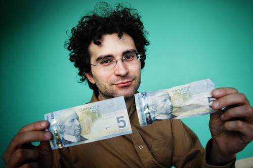 University of Winnipeg Prof. Fabrizio Di Muro has conducted research that shows people are more willing to spend old money than new money while out shopping. 121115 November 15, 2012 Mike Deal / Winnipeg Free Press