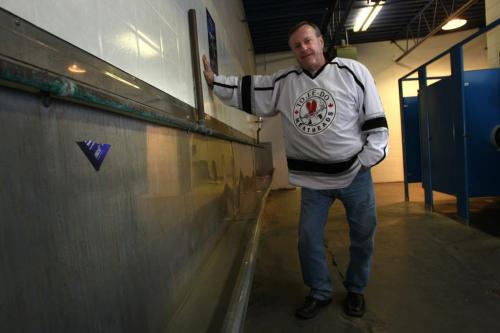 Leigh Young is planning to buy eight feet of the old trough in the Men's room. Salvaging the Canad Inn Stadium story by Ed Tait  (WAYNE GLOWACKI/WINNIPEG FREE PRESS) Winnipeg Free Press  Nov. 16    2012