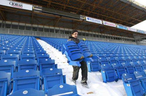 Garrett Iverson helps remove seats purchased by season ticket holders in the Canad Inn Stadium. For  Salvaging the Canad Inn Stadium story by Ed Tait  (WAYNE GLOWACKI/WINNIPEG FREE PRESS) Winnipeg Free Press  Nov. 16    2012