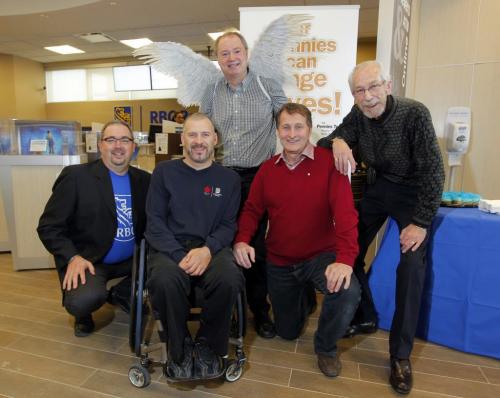 Kevin Rollason with his wings at the Sage Creek RBC event.In the group included is(right to left) Cheer Boards Kai Madsen, Harvests David Northcott, Jared Funk, who won silver in Paralympics in wheelchair rugby, and RBC Bruce Gehlen regional vp. November 16, 2012  BORIS MINKEVICH / WINNIPEG FREE PRESS