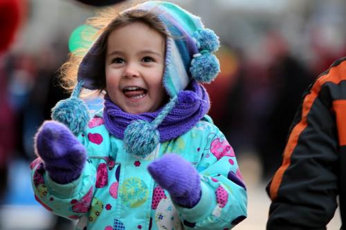 Crowds of wide eyed children gather with thier famiilies  along Portage Ave. Saturday evening during the annual Santa Claus Parade. Three year old Summer Tomchuk enjoys playing games on Portage during the block party which took place just prior to the parade Saturday. Nov 17 ,  2012 (Ruth Bonneville/Winnipeg Free Press)