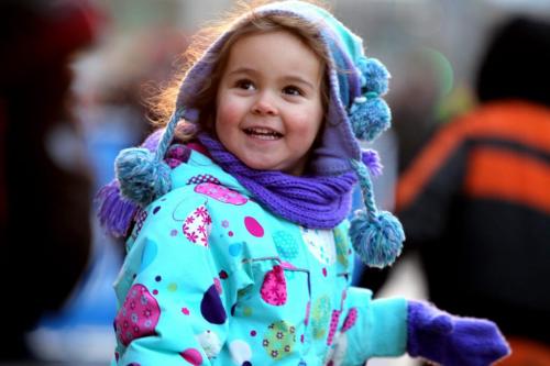 Crowds of wide eyed children gather with thier famiilies  along Portage Ave. Saturday evening during the annual Santa Claus Parade. Three year old Summer Tomchuk enjoys playing games on Portage during the block party which took place just prior to the parade Saturday. Nov 17 ,  2012 (Ruth Bonneville/Winnipeg Free Press)
