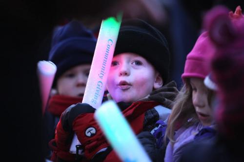 Crowds of wide eyed children gather with thier famiilies  along Portage Ave. Saturday evening during the annual Santa Claus Parade. Three year old Linden Farrant waves his glow stick while watching parade with friends Saturday. Nov 17 ,  2012 (Ruth Bonneville/Winnipeg Free Press)