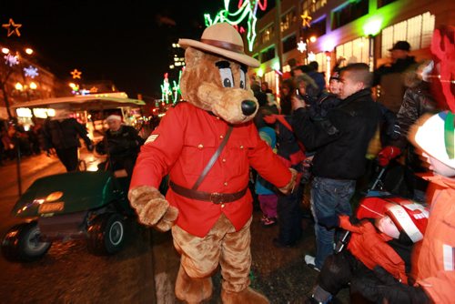 Hundreds gather along Portage Ave. to watch the many floats, clowns, elves and entertainers as they make their way down Portage Ave. during the annual Santa Claus Parade Saturday evening. Nov 17 ,  2012 (Ruth Bonneville/Winnipeg Free Press)