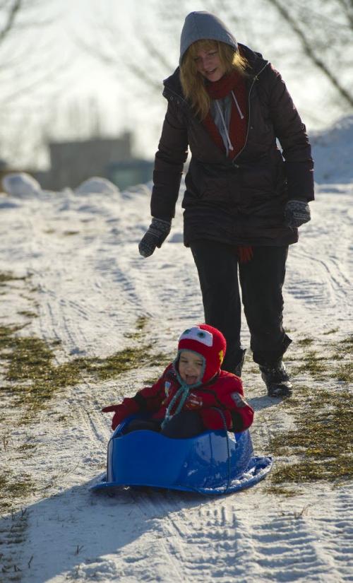 121118 Winnipeg - Wesley Bishops (age 2) get a push down a hill by his Aunt Jannetje Van Went Sunday morning at The Forks. DAVID LIPNOWSKI / WINNIPEG FREE PRESS