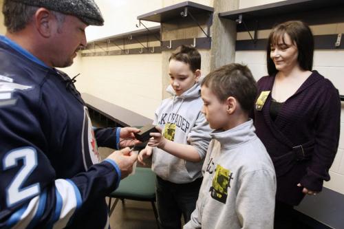 November 18, 2012 - 121118  -  Cole Hein (11)(c) and his brother Eric (11) and mother Mandy meet Cesar Millan prior to Millan's show at the MTS Centre Sunday November 18, 2012. Hein's dog Bingo was trained to bark to alert his parents whenever the child stopped breathing. When Bingo was dying recently Cole Hein set up a Lick-It List which inspired the world and Cesar Millan who set up a foundation in Bingo's name... The Bingo Hein Legacy Fund. John Woods / Winnipeg Free Press