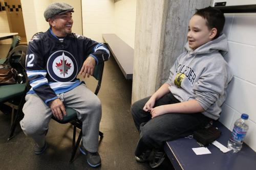November 18, 2012 - 121118  -  Cole Hein shares some wisdom with Cesar Millan in an MTS locker room. Cole Hein (11) and his family Eric (11), mother Mandy, and father Dwayne meet Cesar Millan prior to Millan's show at the MTS Centre Sunday November 18, 2012. Hein's dog Bingo was trained to bark to alert his parents whenever the child stopped breathing. When Bingo was dying recently Cole Hein set up a Lick-It List which inspired the world and Cesar Millan who set up a foundation in Bingo's name... The Bingo Hein Legacy Fund. John Woods / Winnipeg Free Press