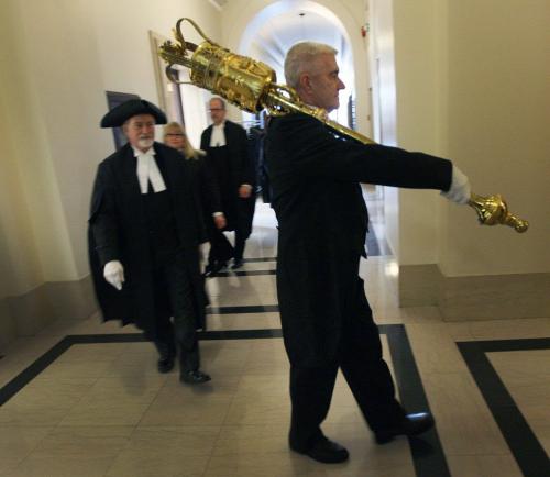Blake Dunn- Sergent-At Arms to the Manitoba Legislative Assembly , front, carries the mace into the Chamber in front of Speaker Daryl Reid for the throne speech  When carried into the chamber the mace signals that the House in session. This is Manitobas second mace which first appeared in 1884. The Mace is just over 1.5 metres high and weighs 9 kilograms- November 16, 2012   (JOE BRYKSA / WINNIPEG FREE PRESS)