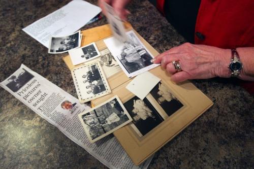 Sheila Heintz, flips through her priceless family photos, that were returned by Larry Chartrand, not pictured-See  Gordon Sinclair story- November 20, 2012   (JOE BRYKSA / WINNIPEG FREE PRESS)