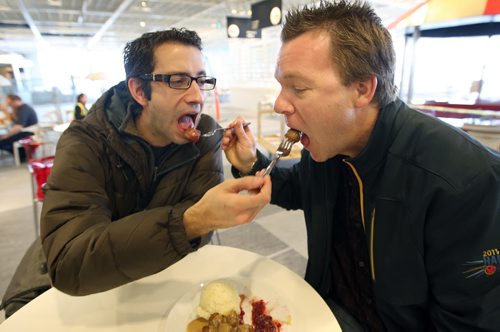 Free Press multimedia editor Tyler Walsh and reporter Geoff Kirbyson try out famous meatballs at the  new Ikea Winnipeg Wednesday. The store will have its grand opening to the public on Nov 28, 2012- The store is 390,000 sq feet and will be the third largest in Canada-See Geoff Kirybson story- November 21, 2012   (JOE BRYKSA / WINNIPEG FREE PRESS)
