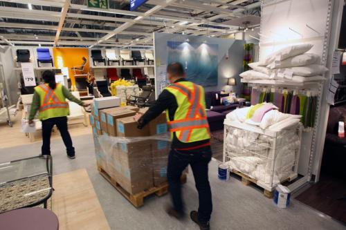 Workers move product as they set up  displays in the new Ikea Winnipeg Wednesday. The store will have its grand opening to the public on Nov 28, 2012- The store is 390,000 sq feet and will be the third largest in Canada-See Geoff Kirybson story- November 21, 2012   (JOE BRYKSA / WINNIPEG FREE PRESS)