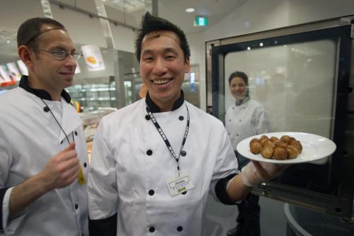 Ikea kitchen staff named Jimmy show off the famous meatballs at the  new Ikea Winnipeg Wednesday. The store will have its grand opening to the public on Nov 28, 2012- The store is 390,000 sq feet and will be the third largest in Canada-See Geoff Kirybson story- November 21, 2012   (JOE BRYKSA / WINNIPEG FREE PRESS)
