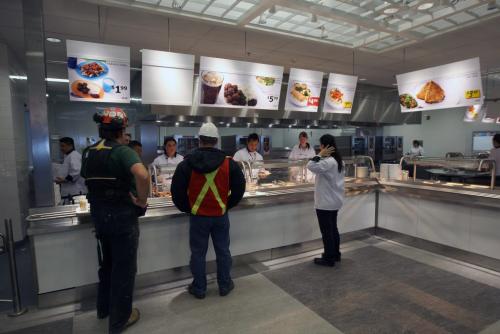 Ikea kitchen staff serve food at reduced prices to  all that are working at the  new Ikea Winnipeg Wednesday. The store will have its grand opening to the public on Nov 28, 2012- The store is 390,000 sq feet and will be the third largest in Canada-See Geoff Kirybson story- November 21, 2012   (JOE BRYKSA / WINNIPEG FREE PRESS)