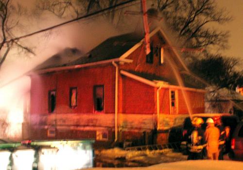 Photo by neighbour Rolf Bandlow, Winnipeg Fire Fighters at the scene of a house fire on Hethrington Ave. Thursday morning.  Winnipeg Free Press  Nov. 22   2012