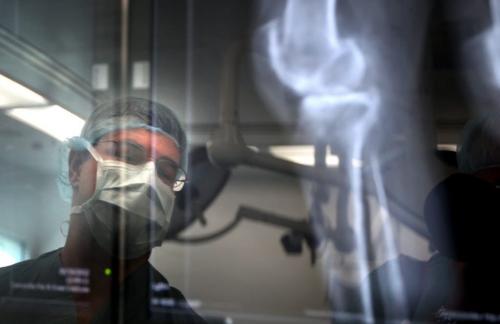 Surgeon, Dr Thomas Turgeon checks digital x-rays prior to knee replacement surgery at Concordia Hospital Monday moring. August 13, 2012 - Phil Hossack / Winnipeg Free Press