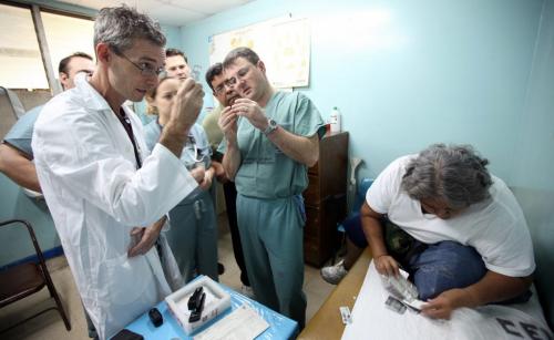 Dr Stephen Henry (left) and Dr Tom Turgeon and a combined team of specilists from Winnipeg and Managua, check a patients meds during an assessment prior to surgery. Phil Hossack / Winnipeg Free Press October 25, 2012