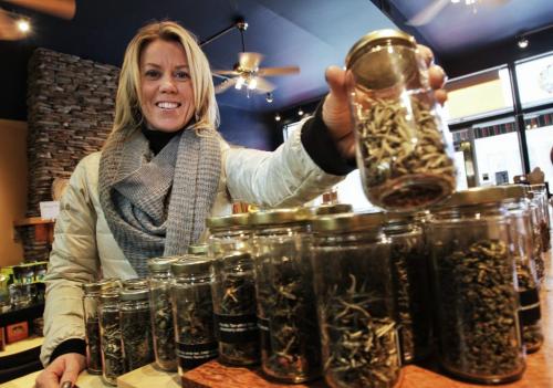 Our Winnipeg Brandi Parnell picks up a jar of loose tea at the Cornelia Bean tea shop on Academy. 121122 November 22, 2012 Mike Deal / Winnipeg Free Press