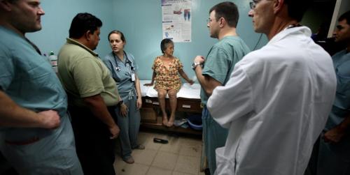A petite Maria Gomez is surrounded by specialists from the Operation Walk team for her assessment prior to surgery. Phil Hossack / Winnipeg Free Press October 25, 2012