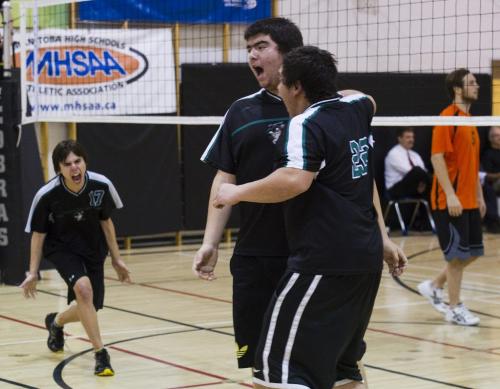 121122 Elm Creek - The Duke of Marlborough Storm's (l-r) Kendall Spence, Quinton Hart, andBryan Flett celebrate a point Thursday. The team made the tremendous journey from Churchill to Elm Creek, MB Thursday November 22, for the Provincial "A" volleyball Championships. The boys led by coach Tim Brock, lost both games to the Reston School Tigers in their first day of play on Thursday. Nick Martin story. DAVID LIPNOWSKI / WINNIPEG FREE PRESS