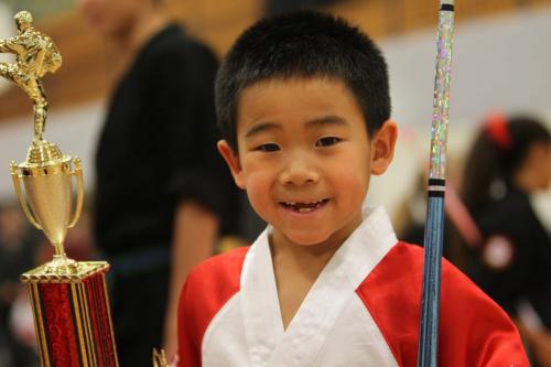Eight year old  Kharsun Khamvongsa competes at the 1st Canadian All Martial Arts Open Tournament held at Maples Collegiate Saturday.  The young Canadian National martial arts team member went on to win the Grand Champion trophy in his division.  The events included: continuous fighting, hand forms, point sparring, stick fighting and musical creative hand forms and weapons hand forms.  The tournament was open to all all ages and all styles and was hosted by the Winnipeg Sikaran Arnis Academy. Standup photo Nov  24, 2012, Ruth Bonneville  (Ruth Bonneville /  Winnipeg Free Press)