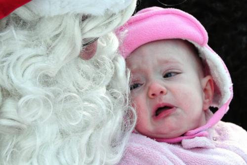 Emma Leitch, 7 months, gets a little emotional while having her photo taken with Santa in the forest at FortWhyte Alive Sunday morning.  121125 November 25, 2012 Mike Deal / Winnipeg Free Press