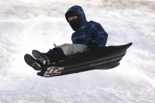Jackson McKay (11) gets some air while sledding on Garbage Hill Sunday, November 25, 2012. (John Woods/Winnipeg Free Press)